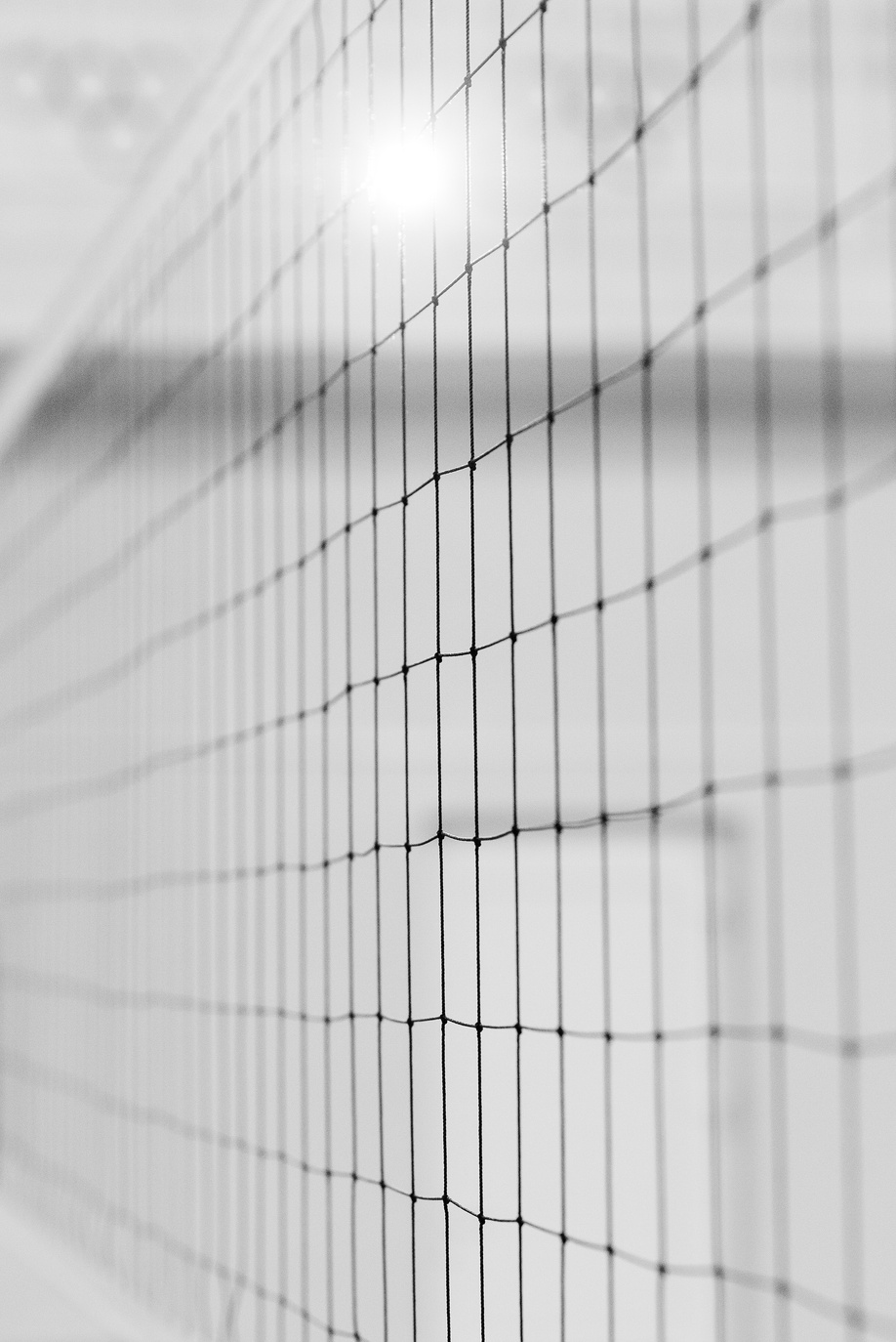 Grayscale Photo of a Volleyball Net